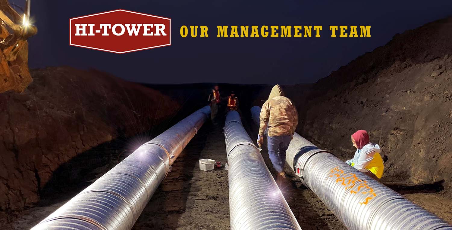 Hi-Tower management team overseeing pipeline and infrastructure project at night.